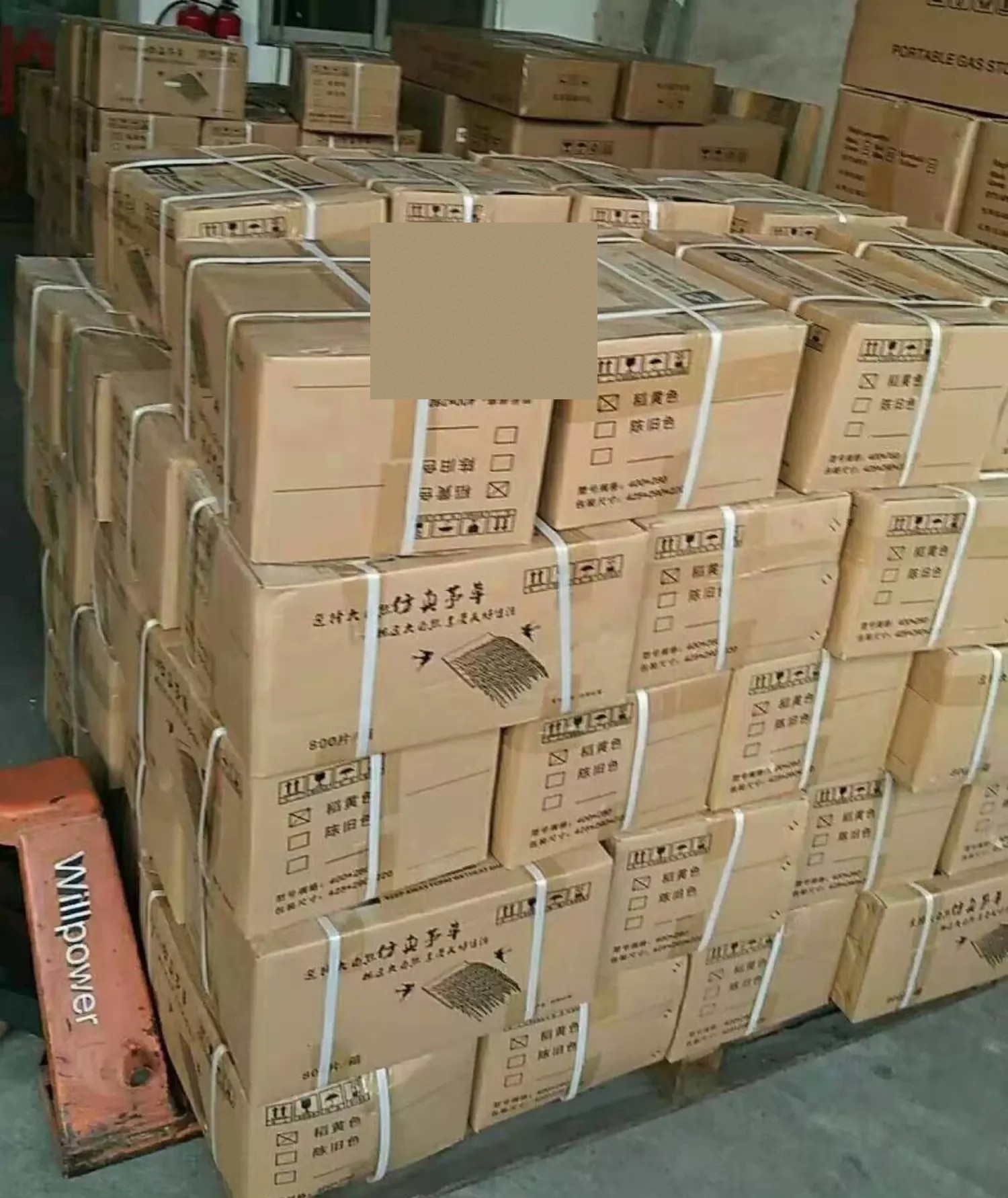 Finished thatch bundles staged for carton packing and palletizing